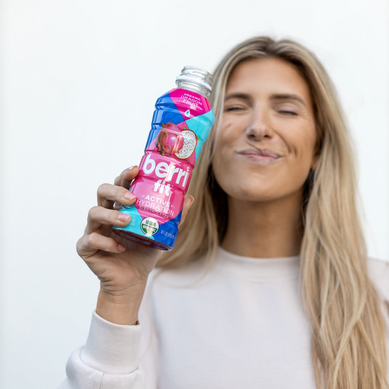 woman with sports drink after a run