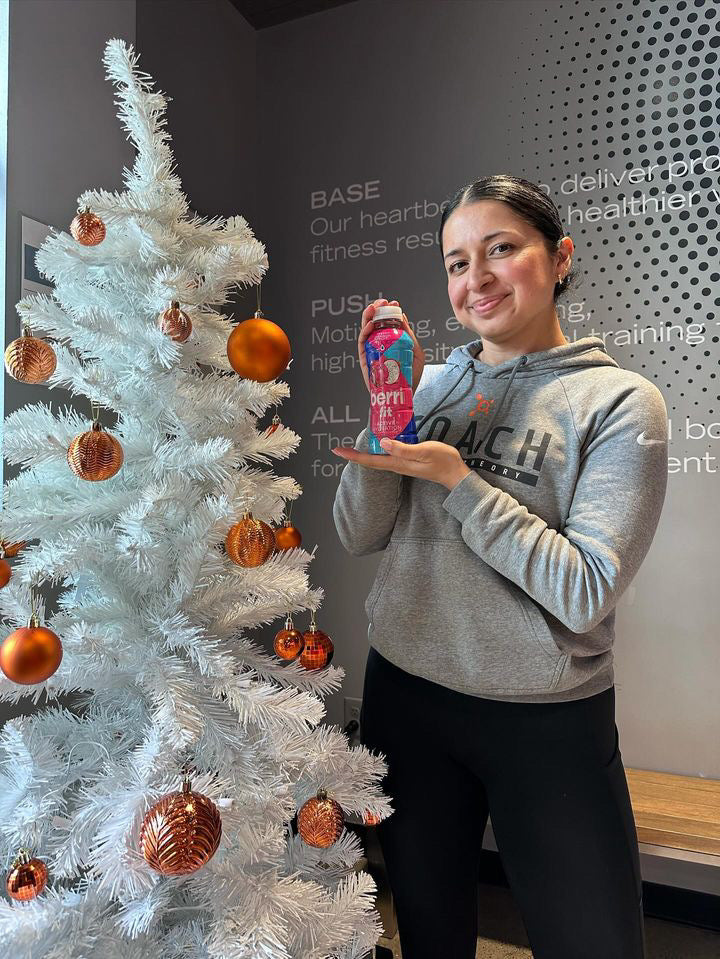 Berri Fit - woman holding organic electrolyte drink