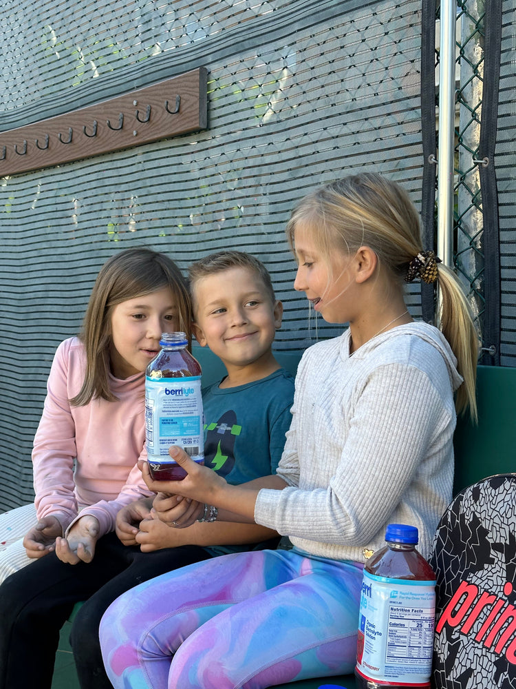 children sharing Berri Lyte product from Berri Organics
