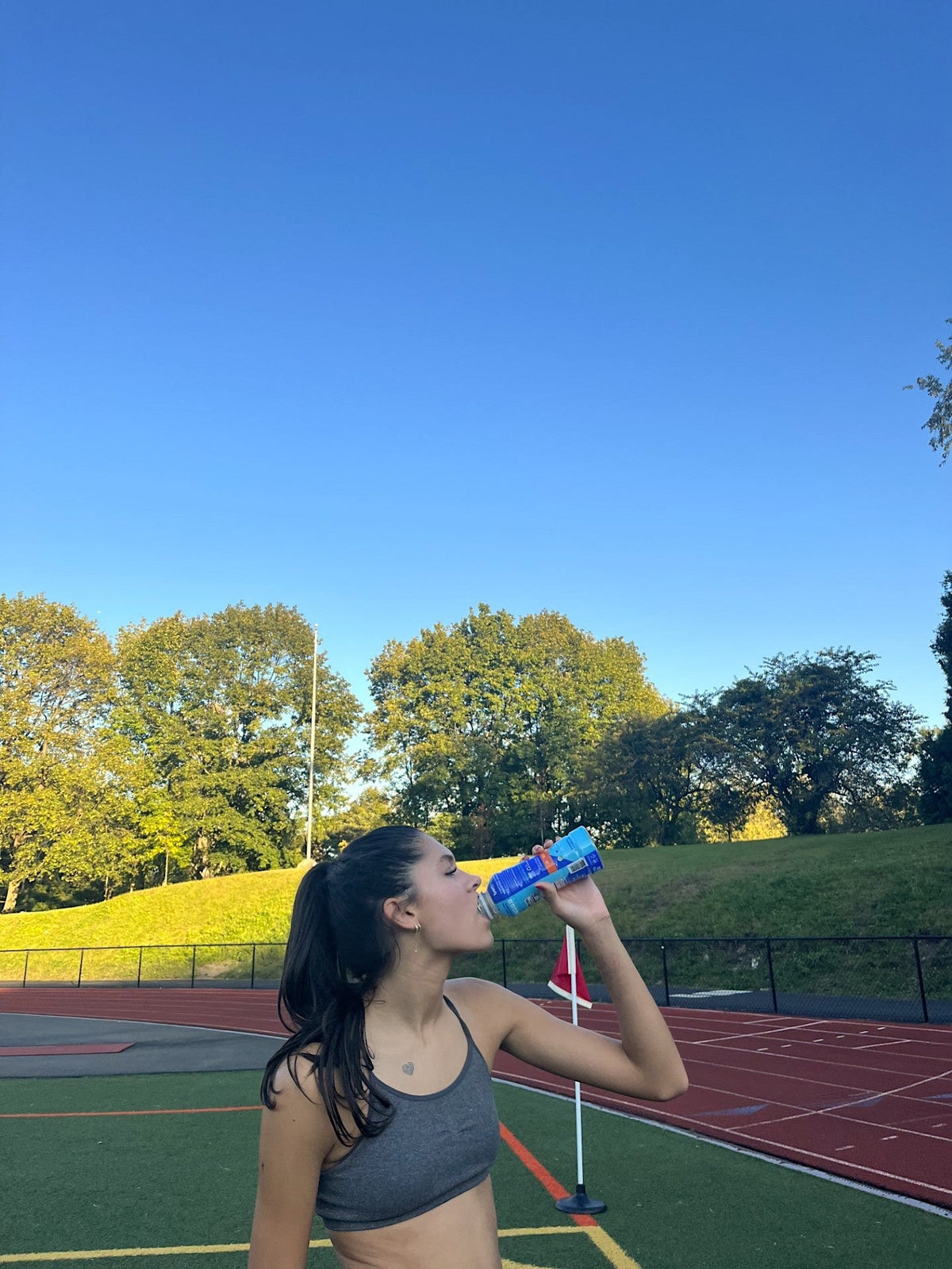 woman Drinks Berri Fit on a track