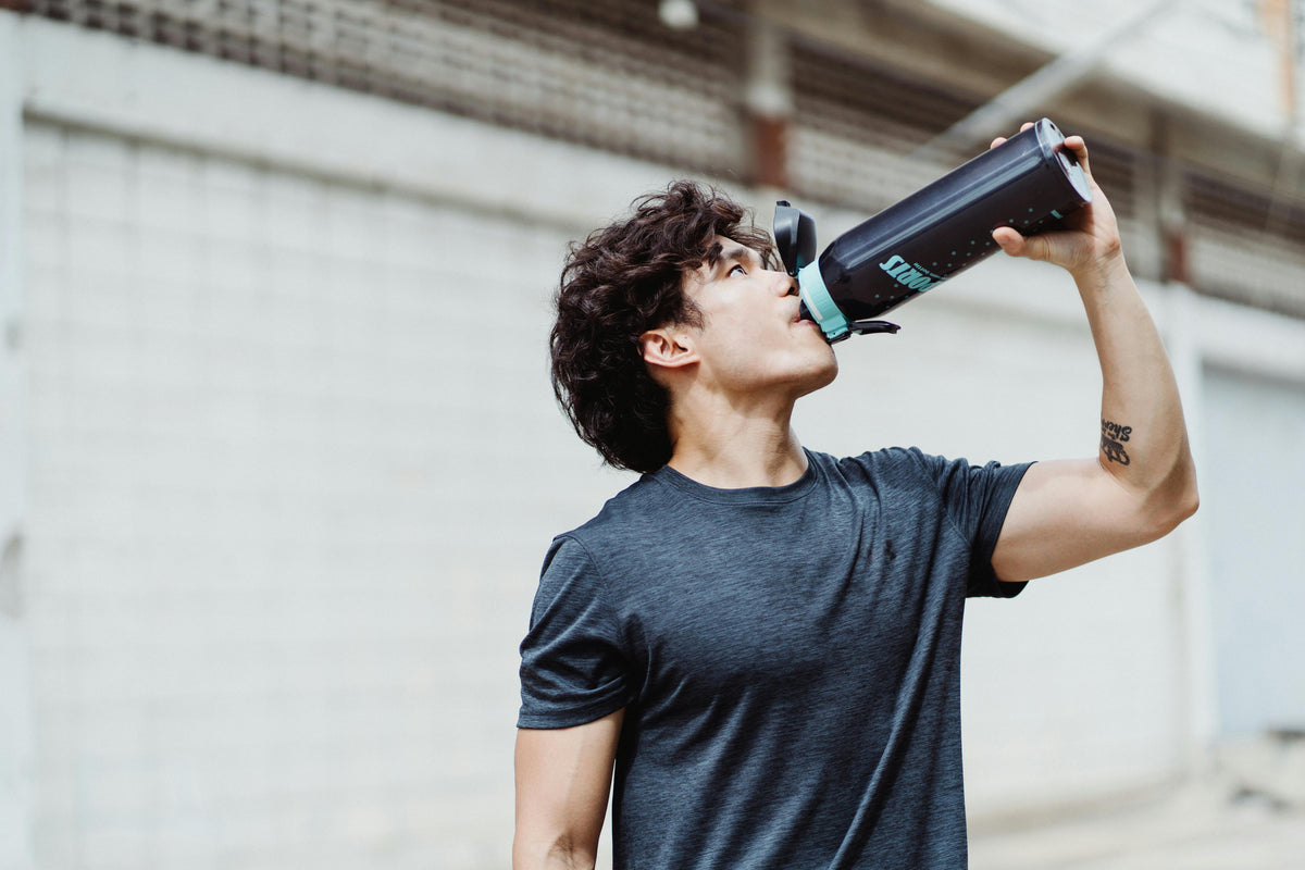 man hydrating | Berri Organics