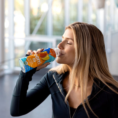 enjoying sports drink after exercise