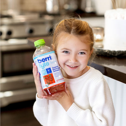 young girl with BerryLyte drink